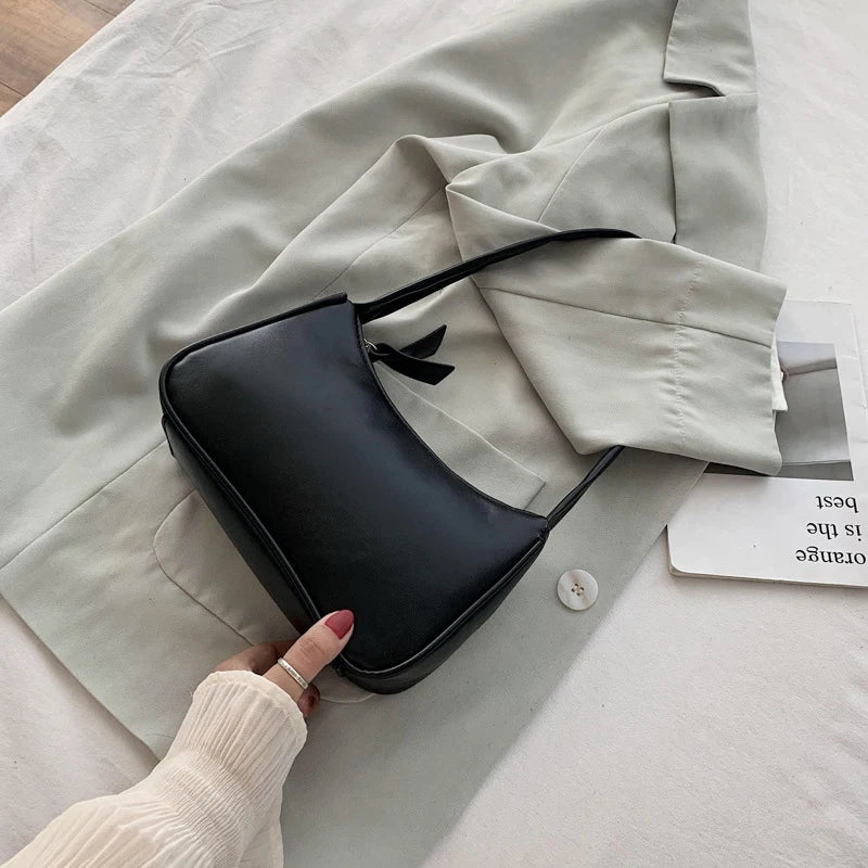 Retro forearm bag women's bow handbag PU leather bag Western style single shoulder minimalist