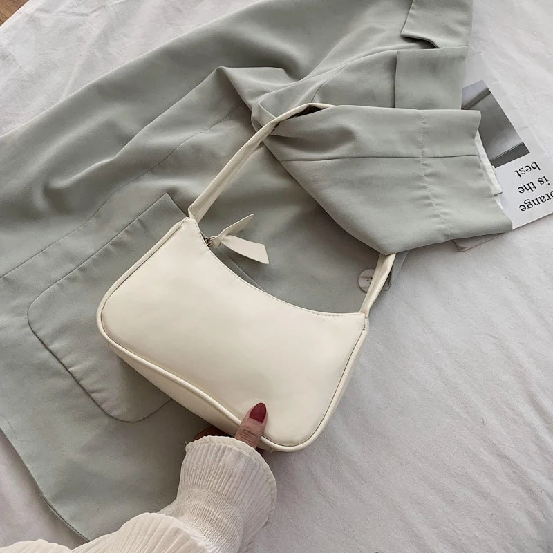 Retro forearm bag women's bow handbag PU leather bag Western style single shoulder minimalist